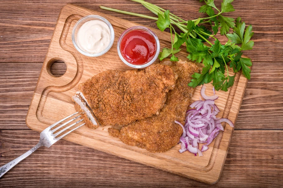 Pork Schnitzel from The Local Butcher on a chopping board